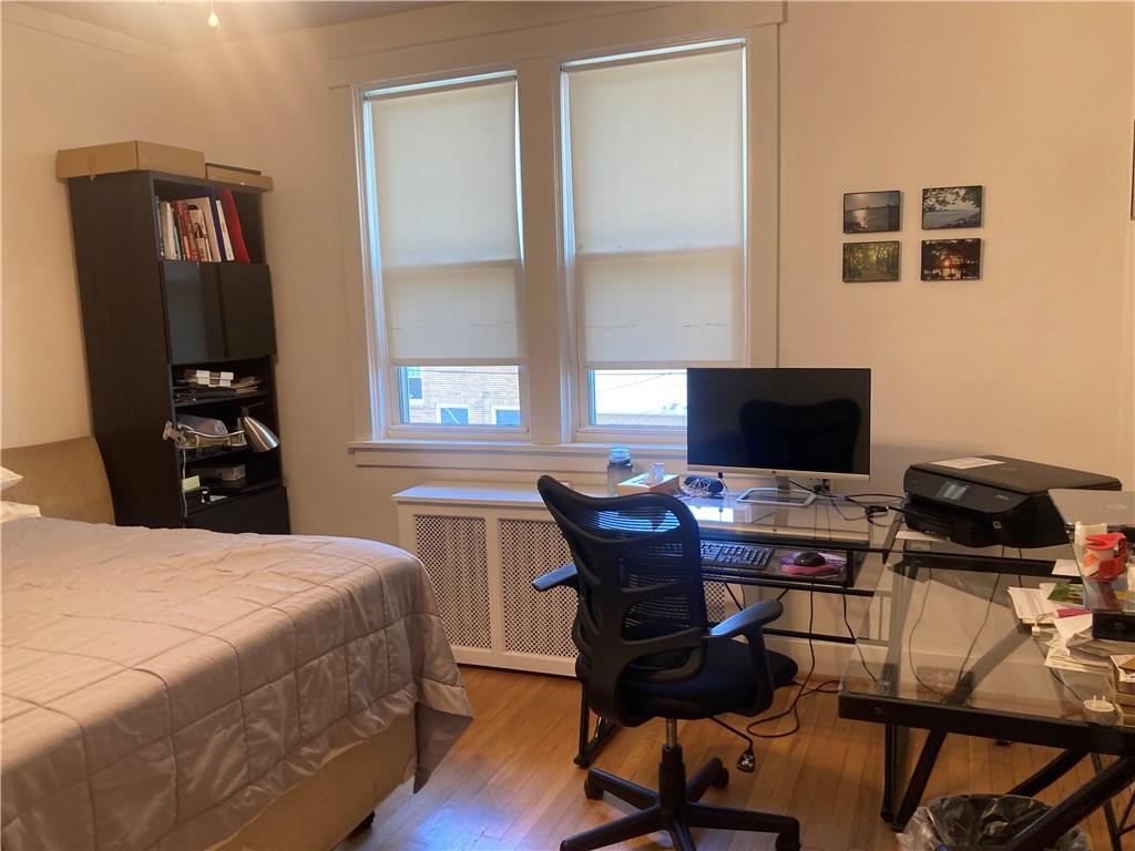 6492 Monitor Street Pittsburgh, PA 15217 - Photo 20 of 42 a bedroom with a bed and a computer on a table