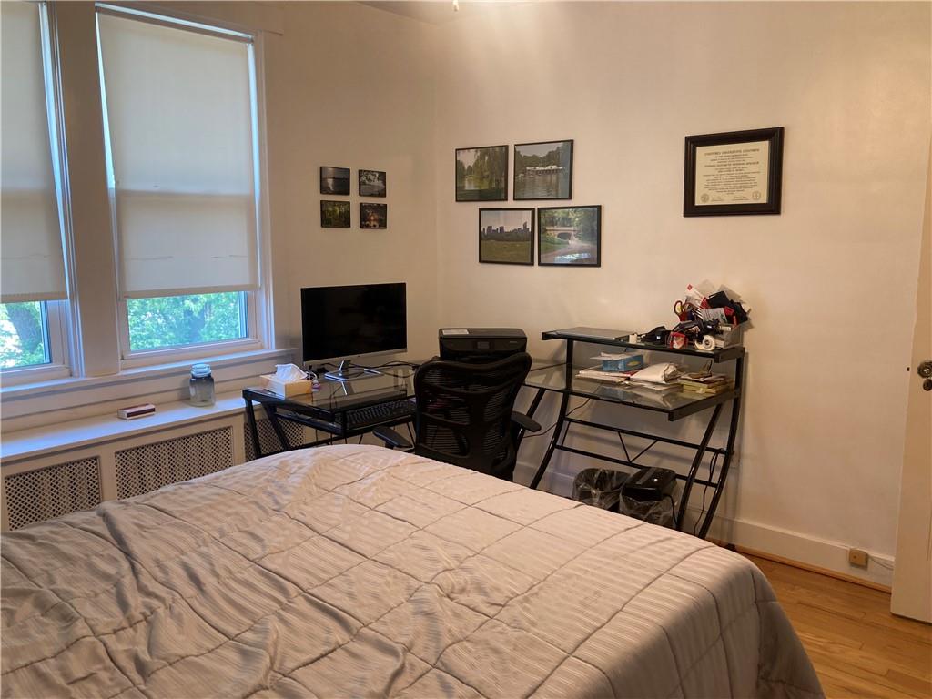 6492 Monitor Street Pittsburgh, PA 15217 - Photo 22 of 42 a bedroom with a bed and a flat screen tv