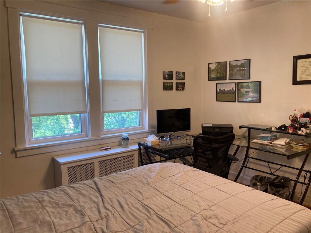 6492 Monitor Street Pittsburgh, PA 15217 - Photo 23 of 42 a bedroom with a bed and a flat screen tv