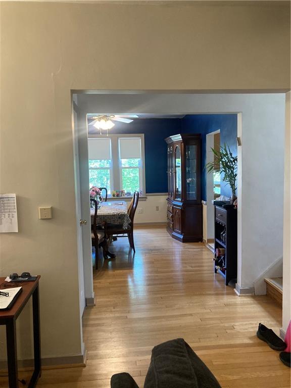 6492 Monitor Street Pittsburgh, PA 15217 - Photo 32 of 42 a living room with furniture and a large mirror with wooden floor