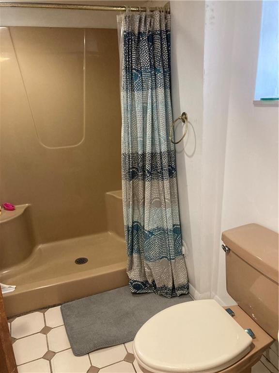 6492 Monitor Street Pittsburgh, PA 15217 - Photo 36 of 42 a bathroom with a toilet and shower