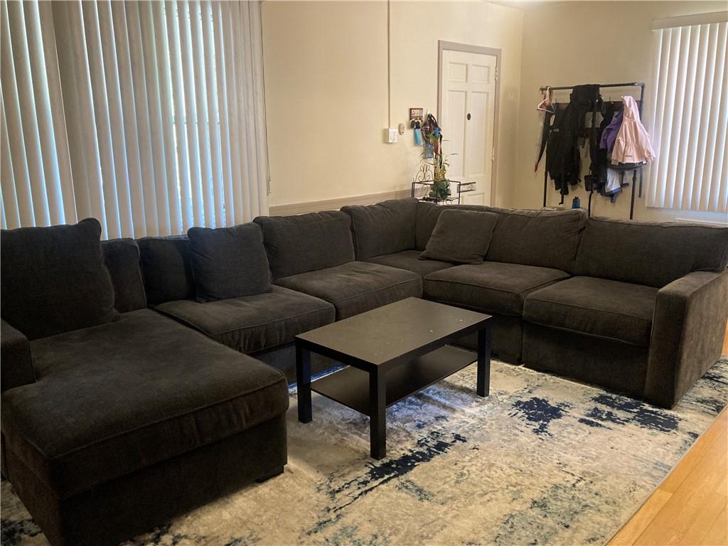 6492 Monitor Street Pittsburgh, PA 15217 - Photo 6 of 42 a living room with furniture and a bed