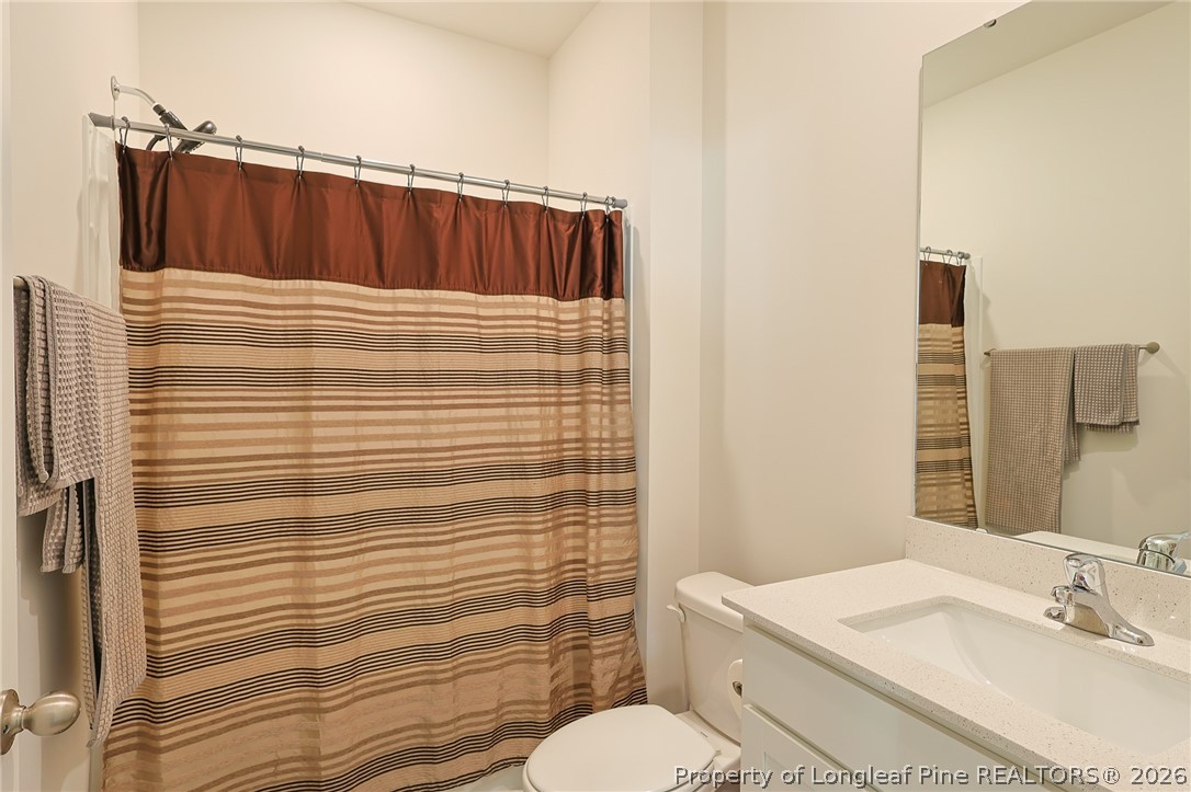 2129 Clydesmill Road Fayetteville, NC 28314 - Photo 13 of 36 a bathroom with a sink toilet and shower
