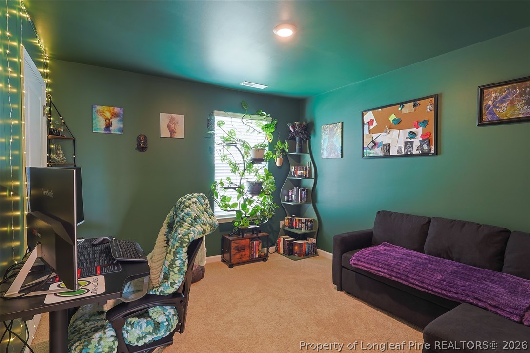 2129 Clydesmill Road Fayetteville, NC 28314 - Photo 15 of 36 a living room with furniture and a flat screen tv