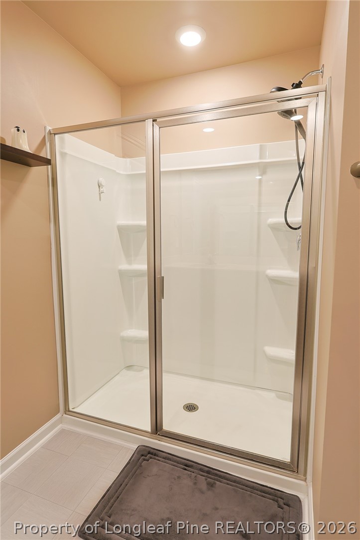 2129 Clydesmill Road Fayetteville, NC 28314 - Photo 19 of 36 a bathroom with a glass shower door
