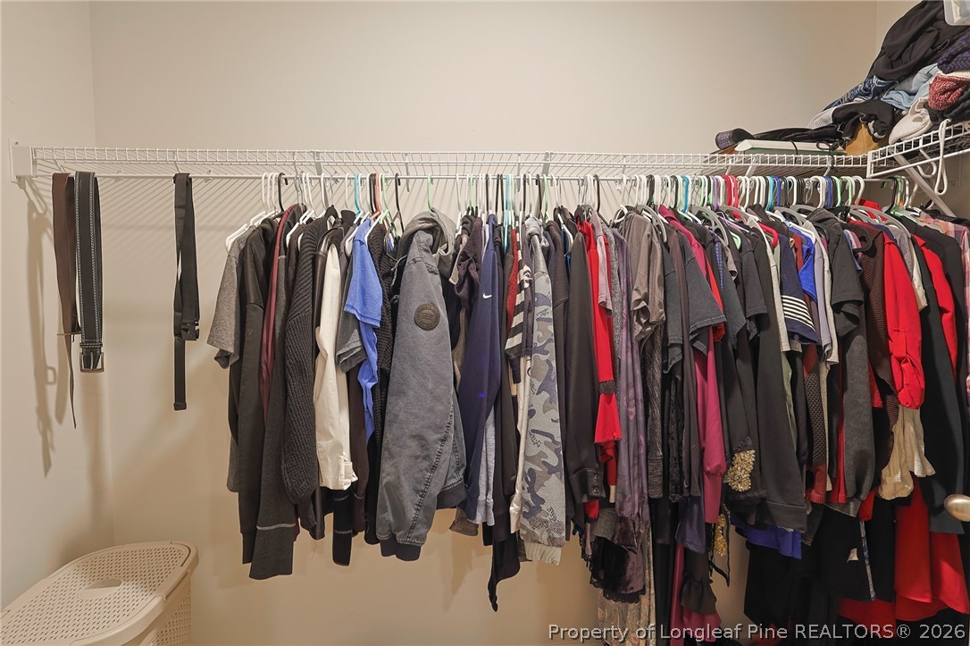 2129 Clydesmill Road Fayetteville, NC 28314 - Photo 21 of 36 a view of walk in closet with clothes