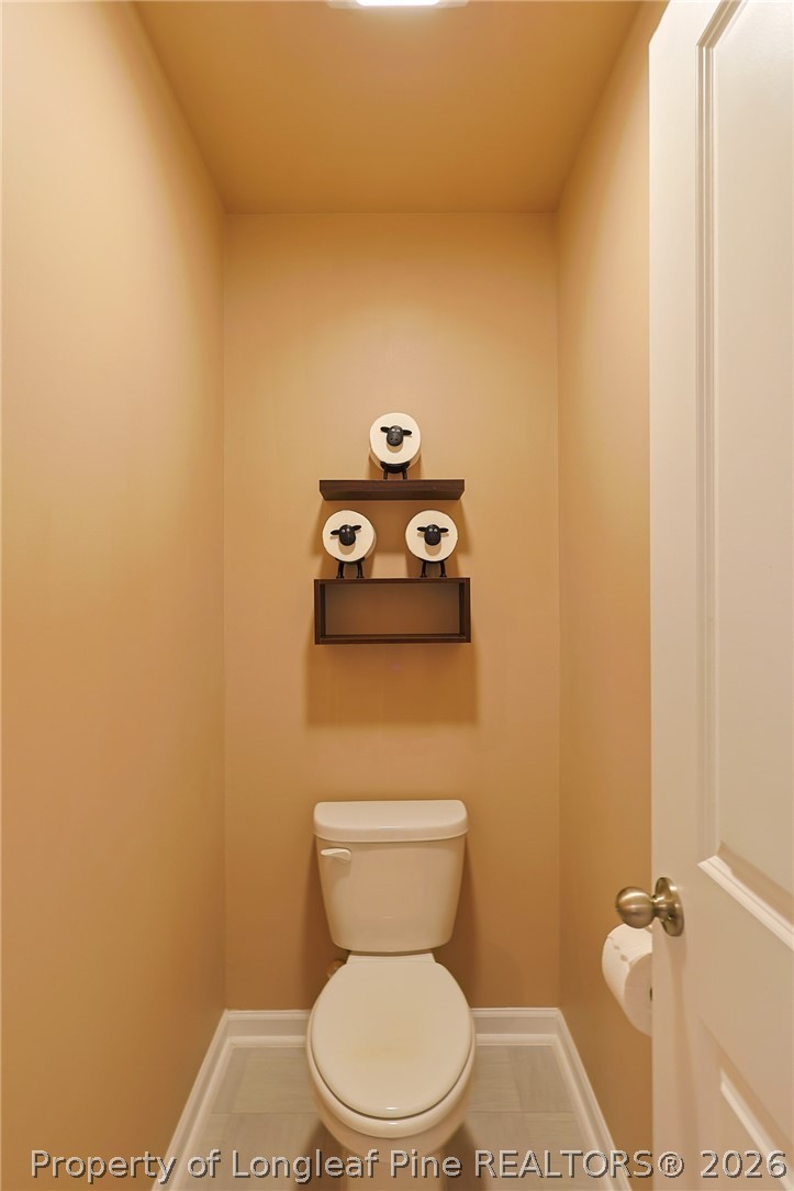 2129 Clydesmill Road Fayetteville, NC 28314 - Photo 22 of 36 a white toilet sitting next to a white wall