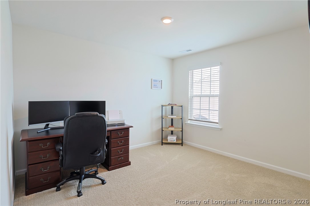 2129 Clydesmill Road Fayetteville, NC 28314 - Photo 25 of 36 a view of a workspace with furniture and a window