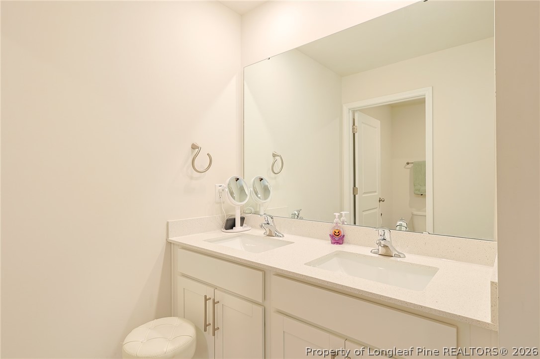 2129 Clydesmill Road Fayetteville, NC 28314 - Photo 27 of 36 a bathroom with a sink and a mirror