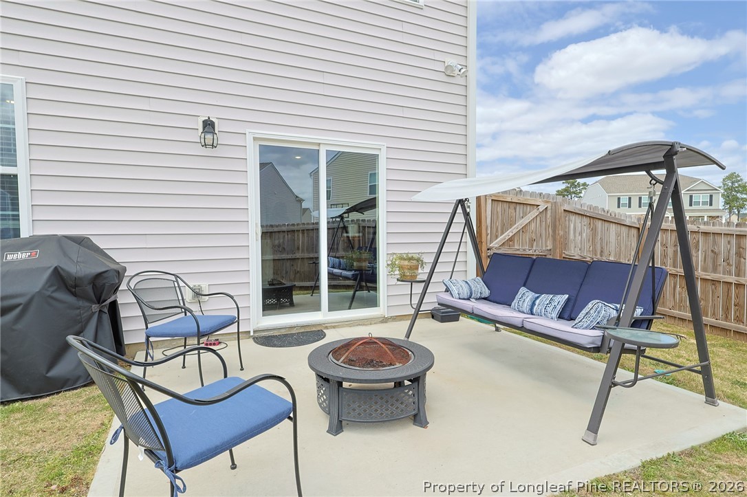 2129 Clydesmill Road Fayetteville, NC 28314 - Photo 31 of 36 a view of a chairs and tables in the back yard of the house