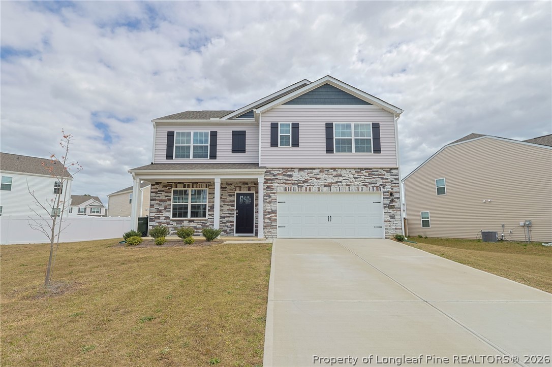 2129 Clydesmill Road Fayetteville, NC 28314 - Photo 34 of 36 a front view of a house with a yard