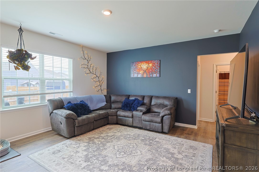 2129 Clydesmill Road Fayetteville, NC 28314 - Photo 9 of 36 a living room with furniture and a flat screen tv