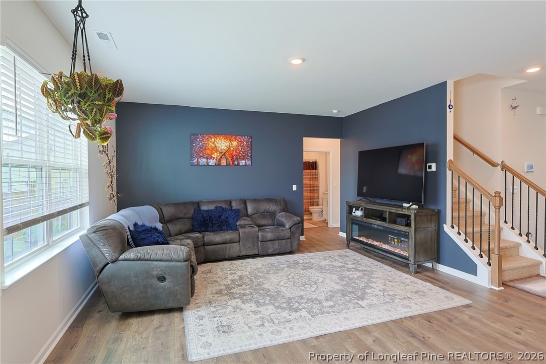 2129 Clydesmill Road Fayetteville, NC 28314 - Photo 10 of 36 a living room with furniture and a flat screen tv