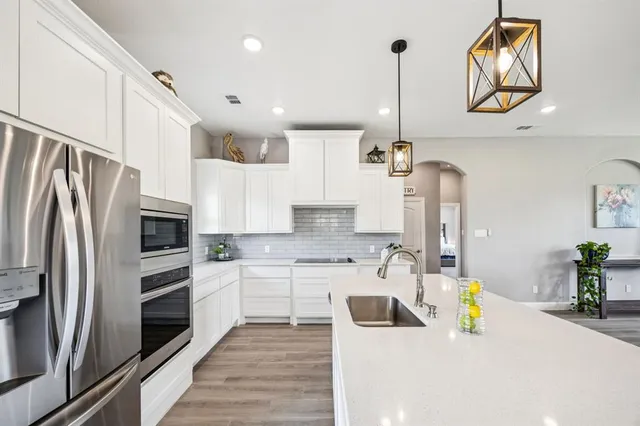 a view of living room with granite countertop furniture and a chandelier