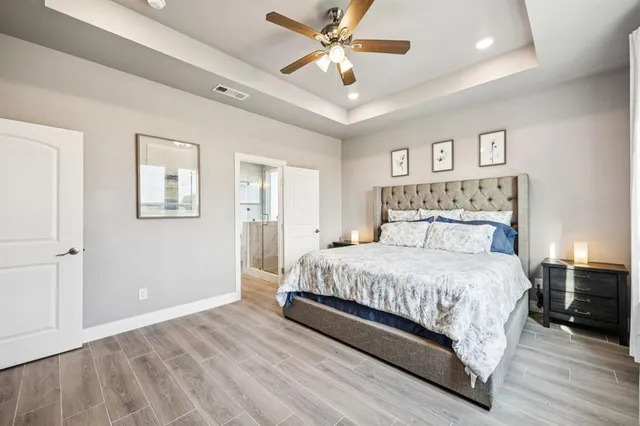 a bedroom with a large bed and a window