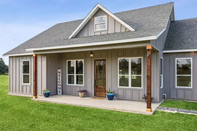 front view of a house with a yard
