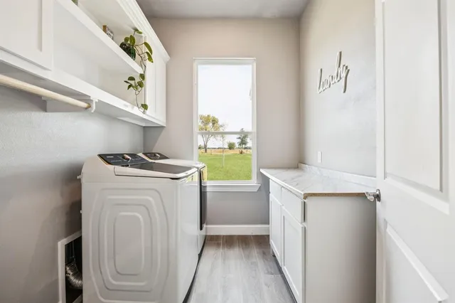 a bathroom with a sink mirror and vanity