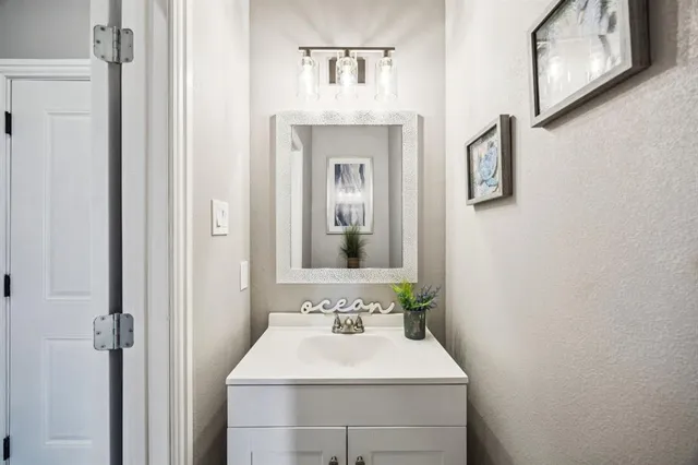 a utility room with sink dryer and washer