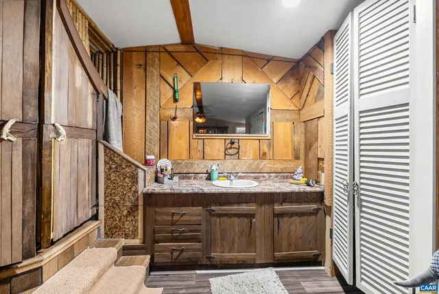 a bathroom with a sink and a mirror