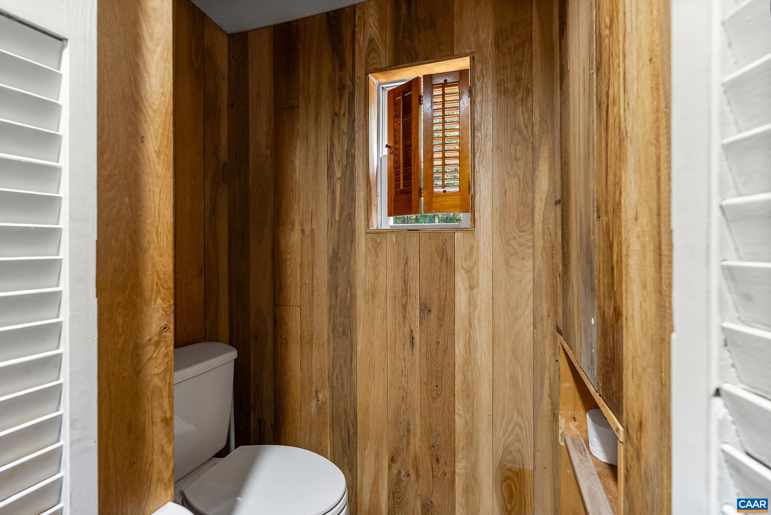 386 Cub Creek Road Appomattox, VA 24522 - Photo 14 of 44 a white toilet sitting next to a bathroom