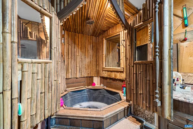 a bathroom with a tub and shower