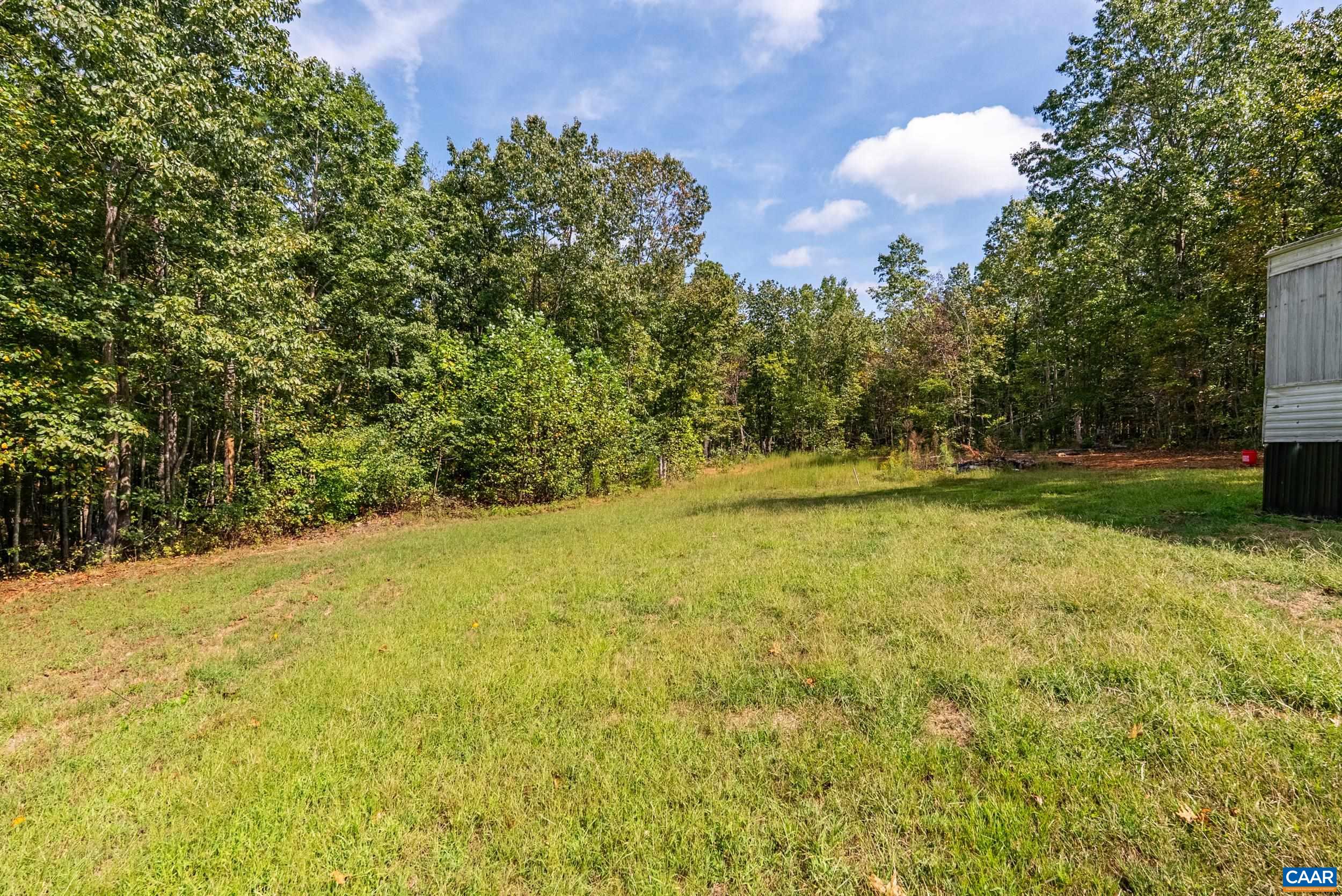 386 Cub Creek Road Appomattox, VA 24522 - Photo 27 of 44 a view of a yard with an trees
