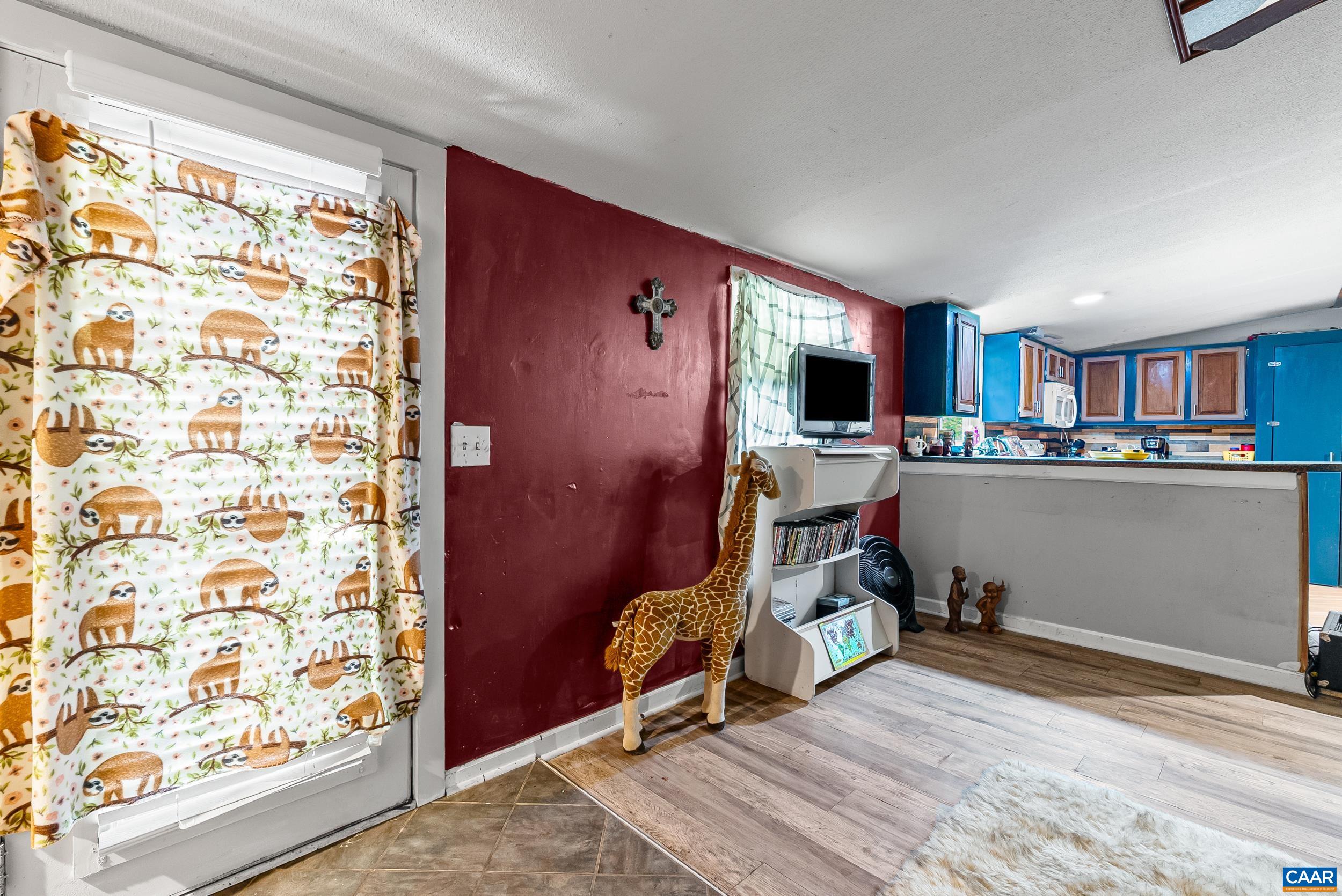 386 Cub Creek Road Appomattox, VA 24522 - Photo 3 of 44 a view of a workspace with furniture and a window