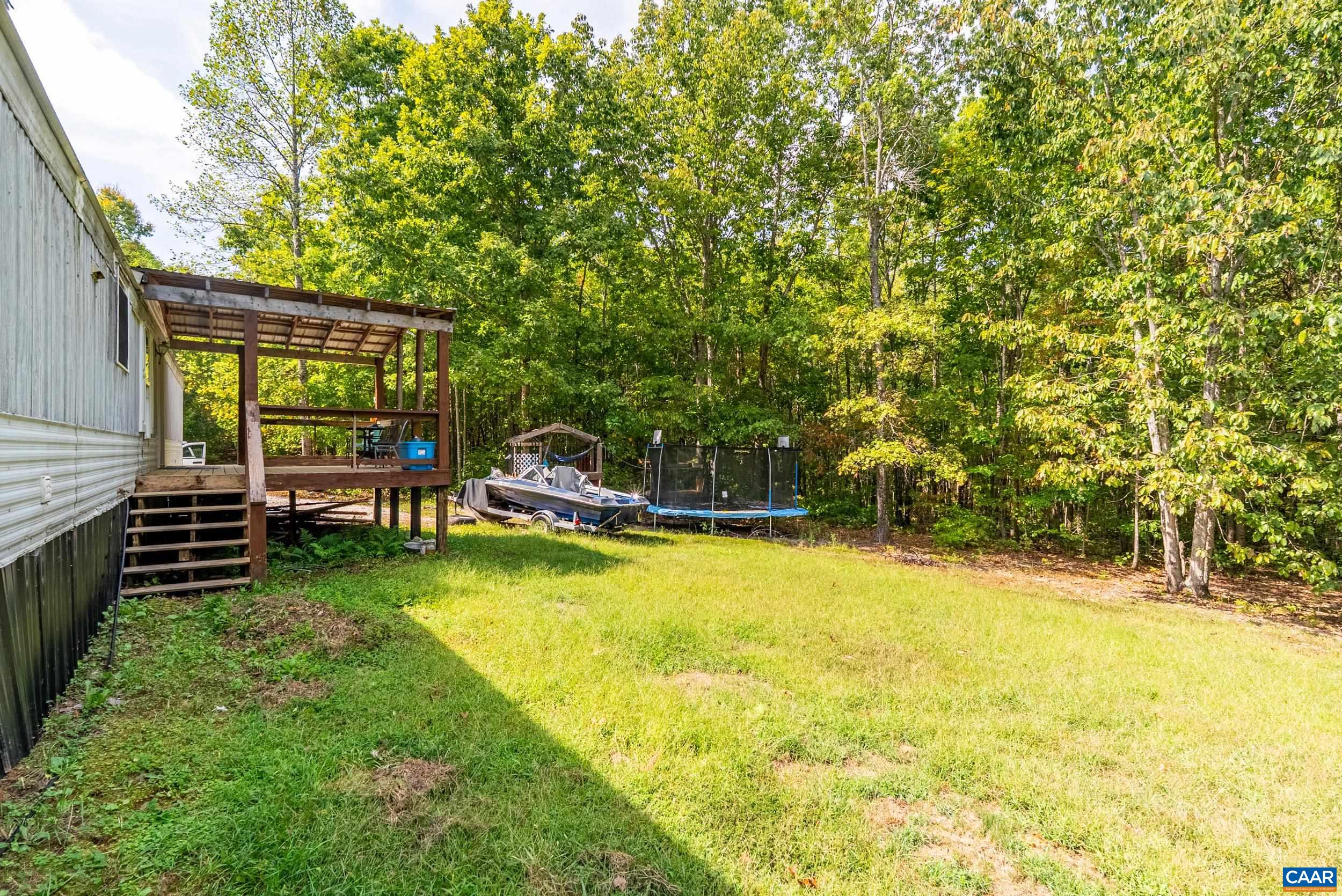 386 Cub Creek Road Appomattox, VA 24522 - Photo 32 of 44 a view of a swimming pool with an outdoor seating and a yard
