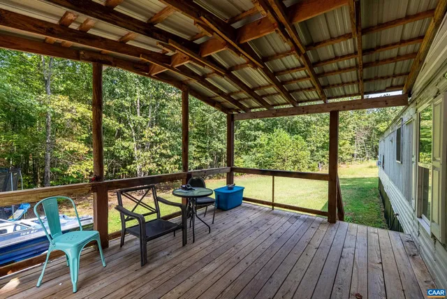a wooden fence with trees in the background