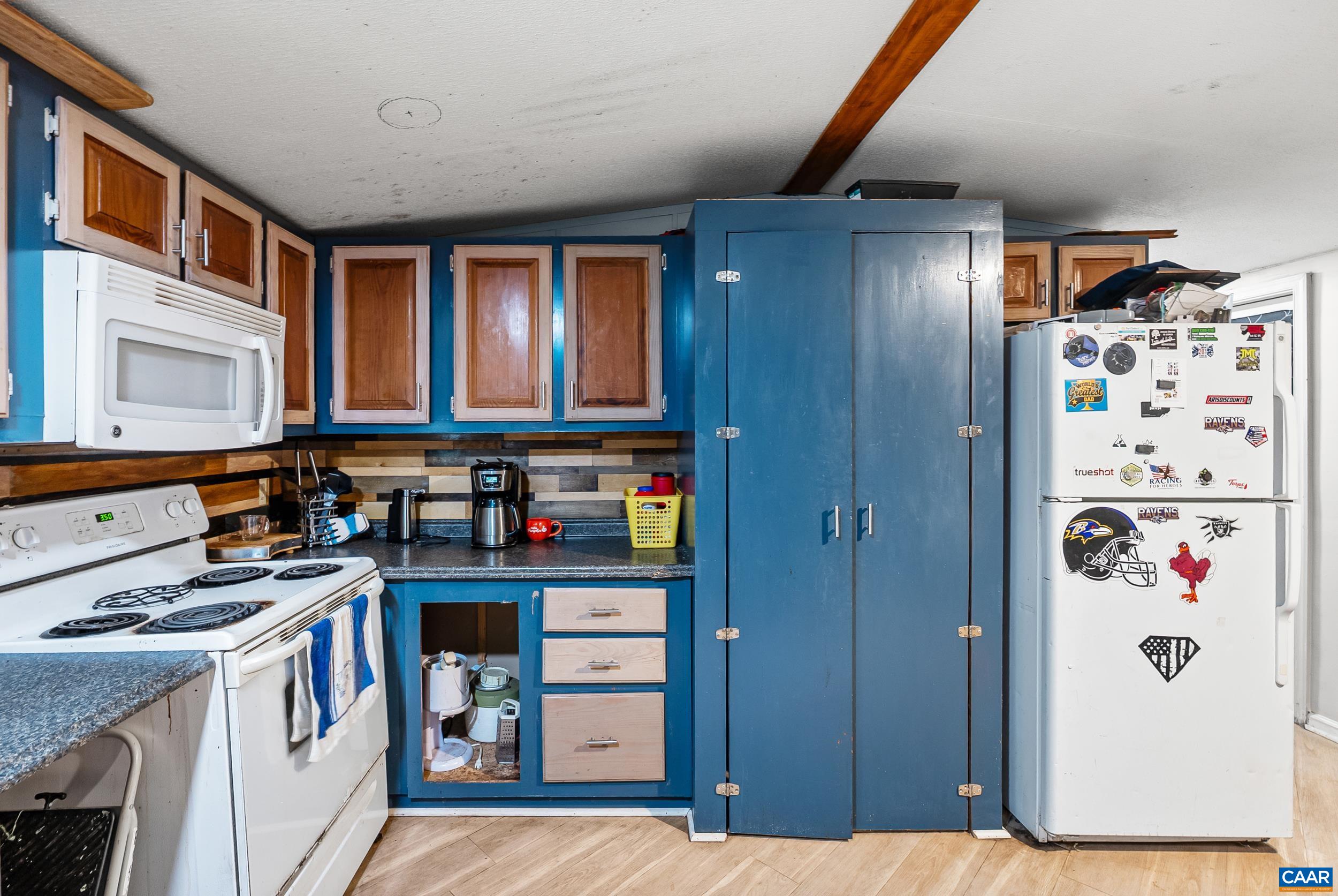 386 Cub Creek Road Appomattox, VA 24522 - Photo 8 of 44 a kitchen with stainless steel appliances granite countertop a refrigerator and a stove