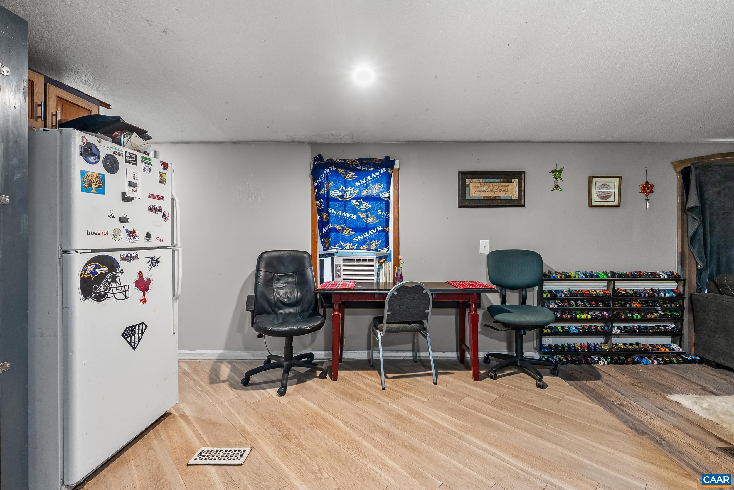 386 Cub Creek Road Appomattox, VA 24522 - Photo 9 of 44 a view of a workspace with furniture and a window