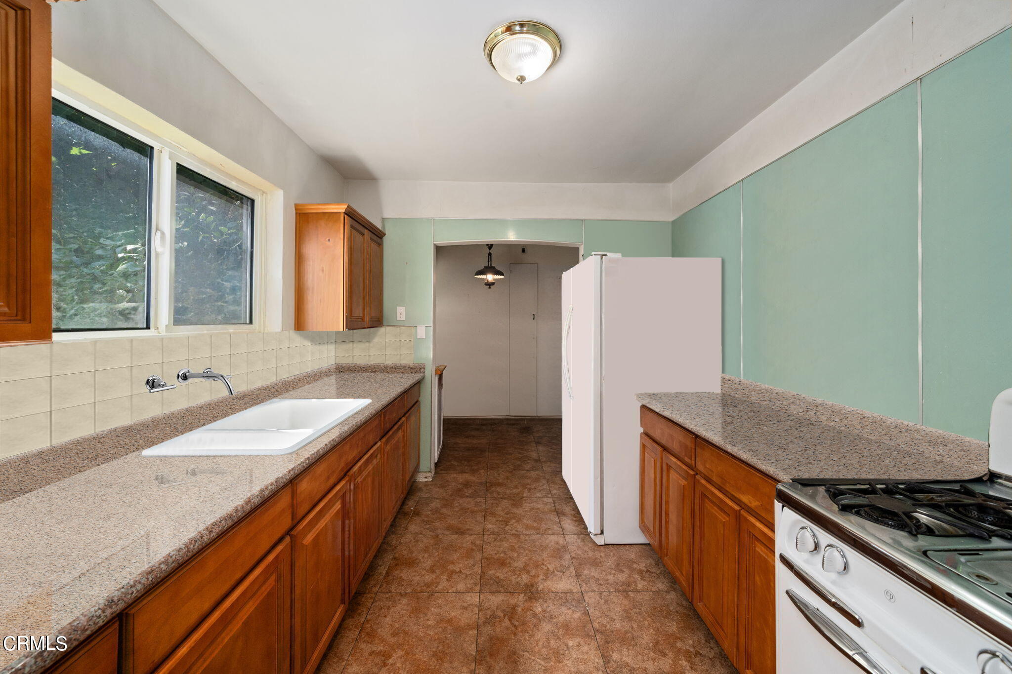 375 West Duarte Road Arcadia, CA 91007 - Photo 9 of 13 a kitchen with granite countertop a sink and a stove top oven
