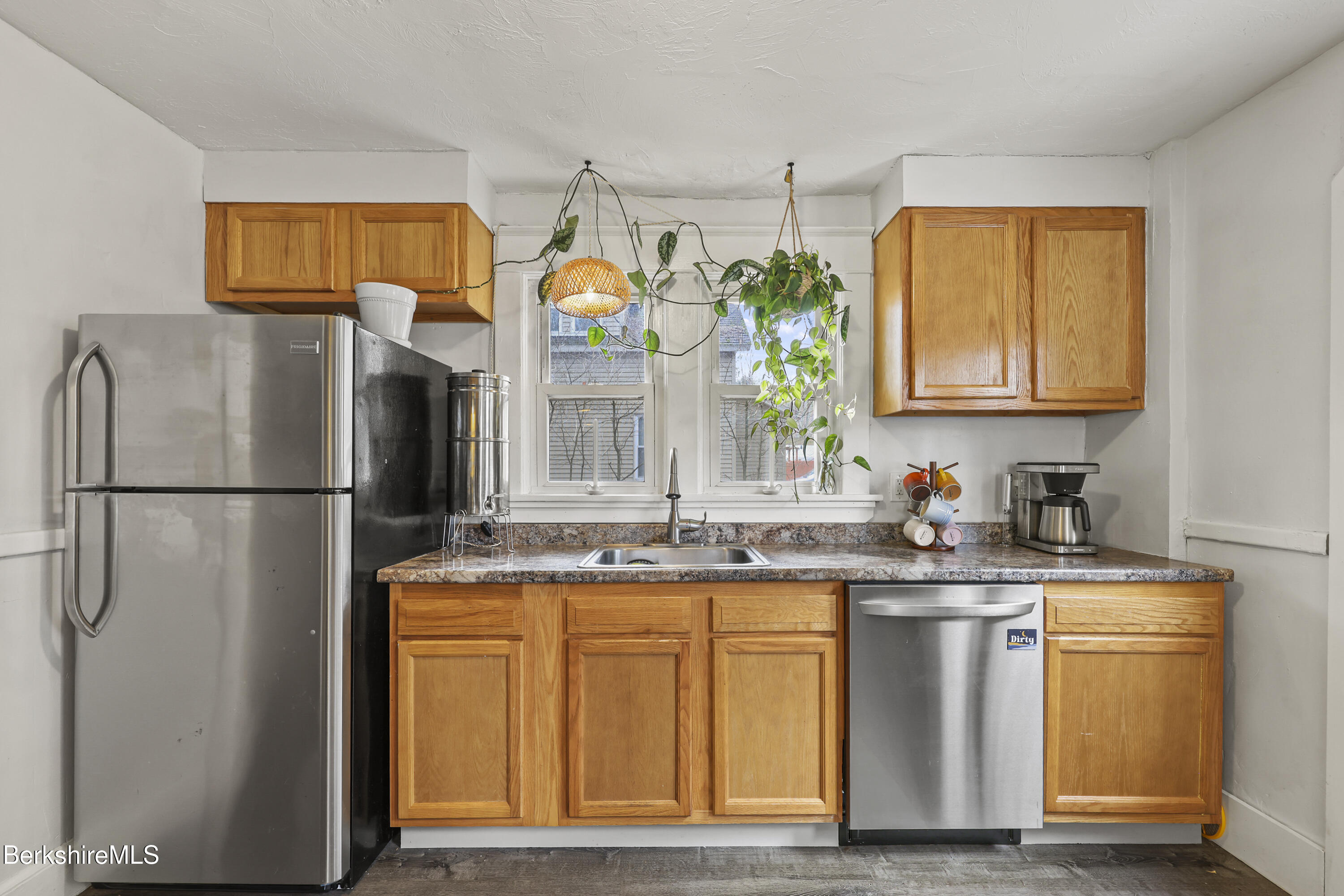 27 Morgan Street Pittsfield, MA 01201 - Photo 12 of 33 a kitchen with stainless steel appliances granite countertop a refrigerator a sink and a stove