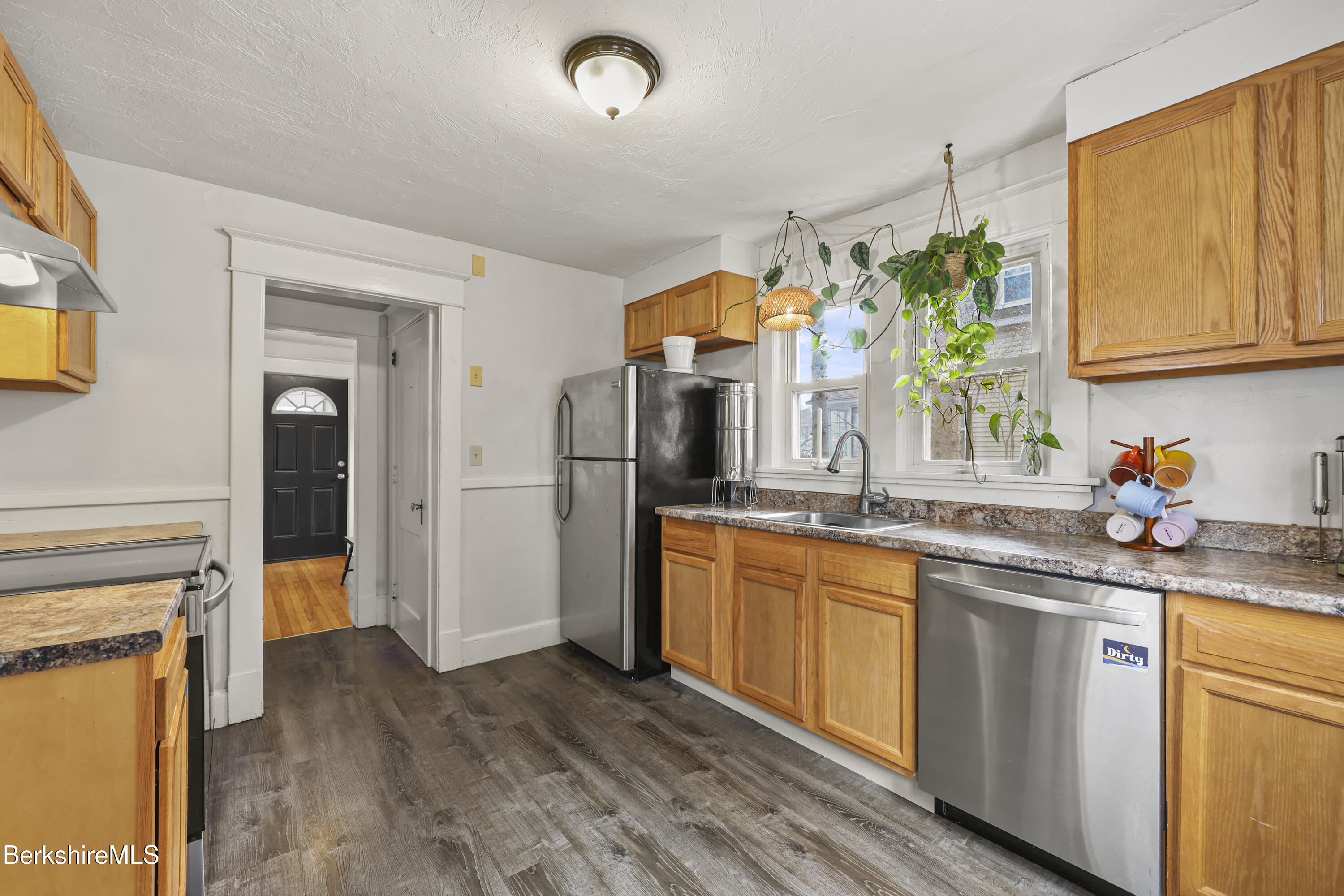 27 Morgan Street Pittsfield, MA 01201 - Photo 13 of 33 a kitchen with stainless steel appliances granite countertop a sink and cabinets