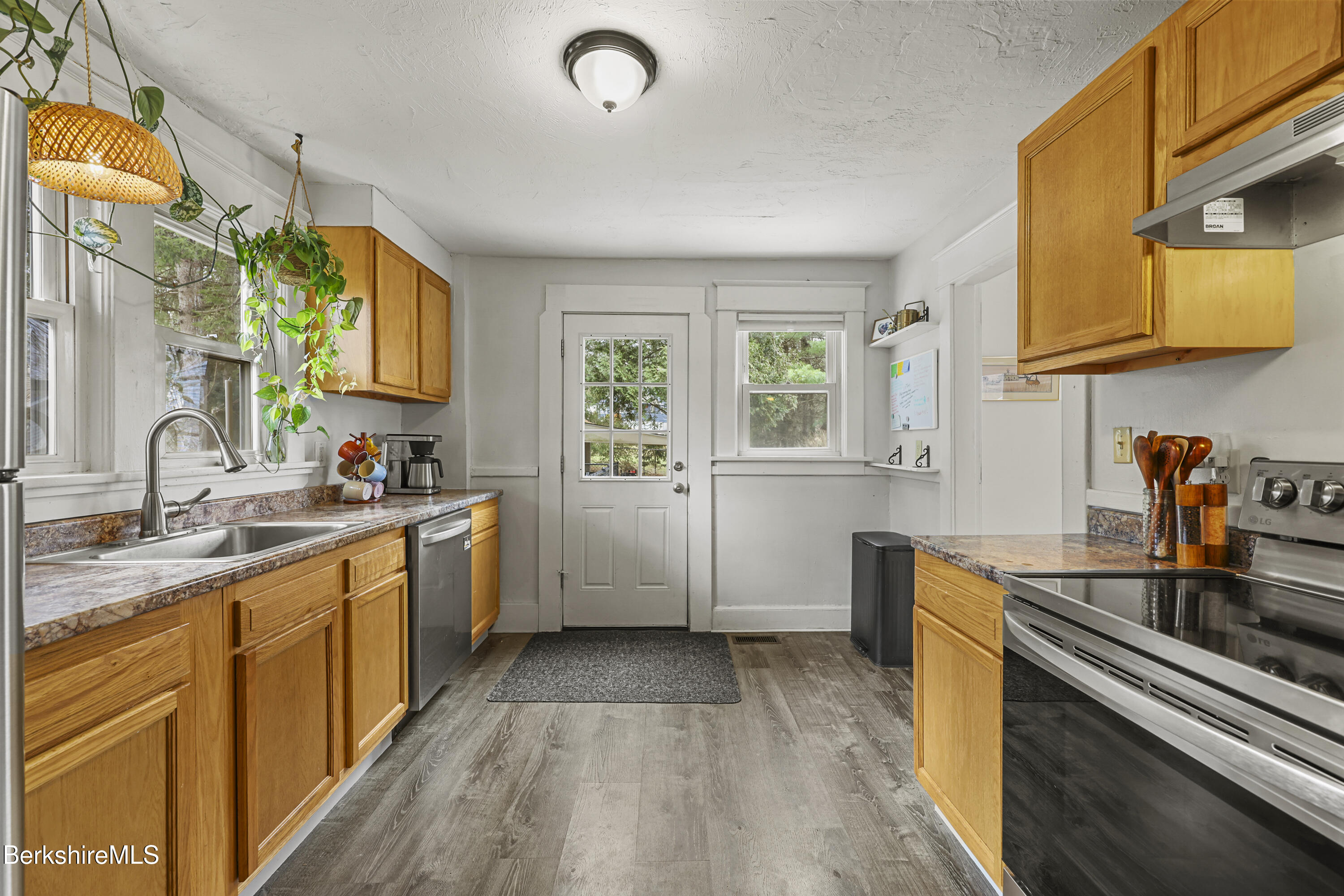 27 Morgan Street Pittsfield, MA 01201 - Photo 16 of 33 a kitchen with a sink stove and cabinets