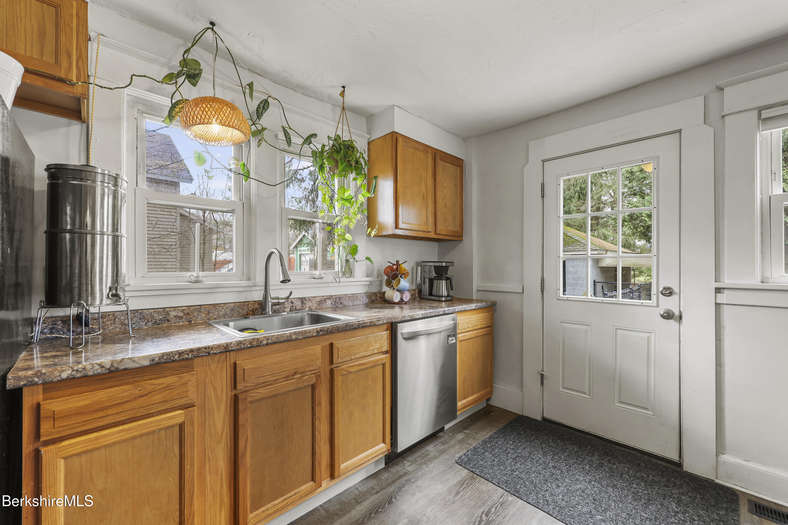 27 Morgan Street Pittsfield, MA 01201 - Photo 17 of 33 a bathroom with double vanity sink a two mirror a window and a mirror