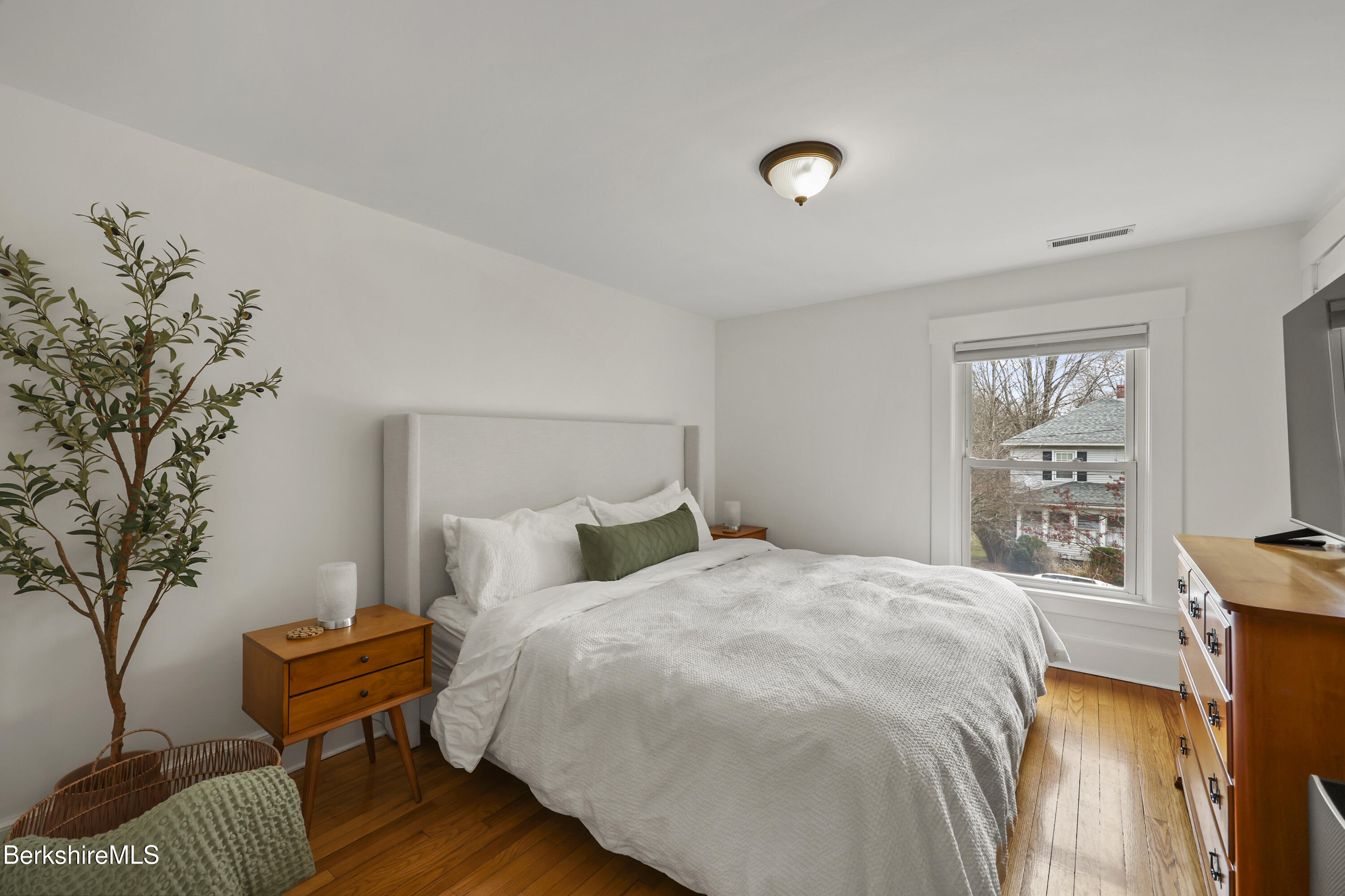 27 Morgan Street Pittsfield, MA 01201 - Photo 18 of 33 a bedroom with a bed and a night stand