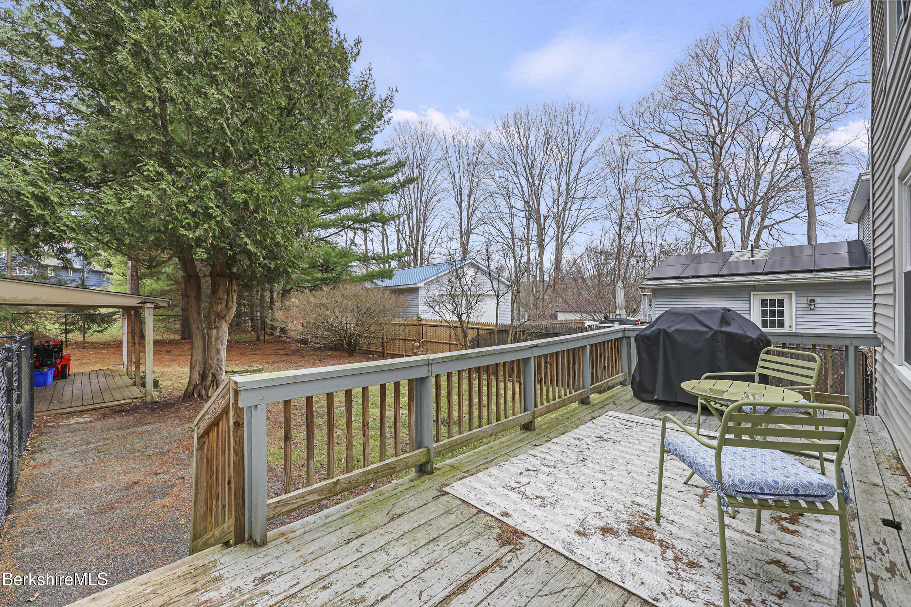 27 Morgan Street Pittsfield, MA 01201 - Photo 27 of 33 a view of a deck with furniture and trees