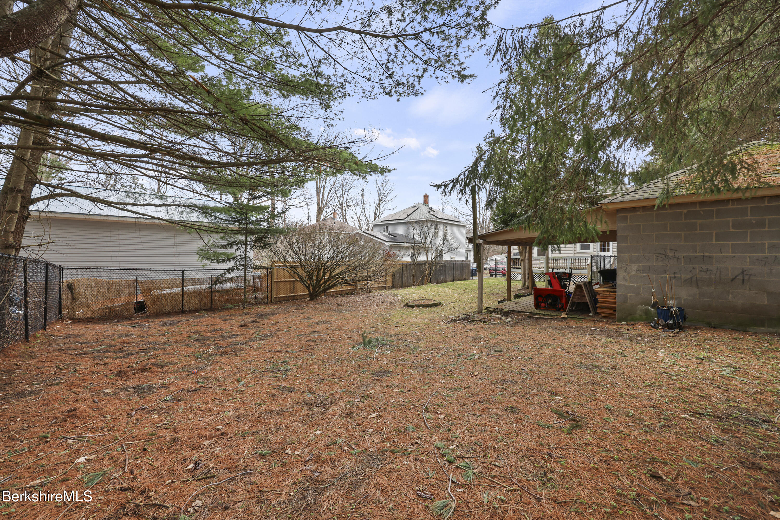 27 Morgan Street Pittsfield, MA 01201 - Photo 29 of 33 a view of a backyard with a large tree