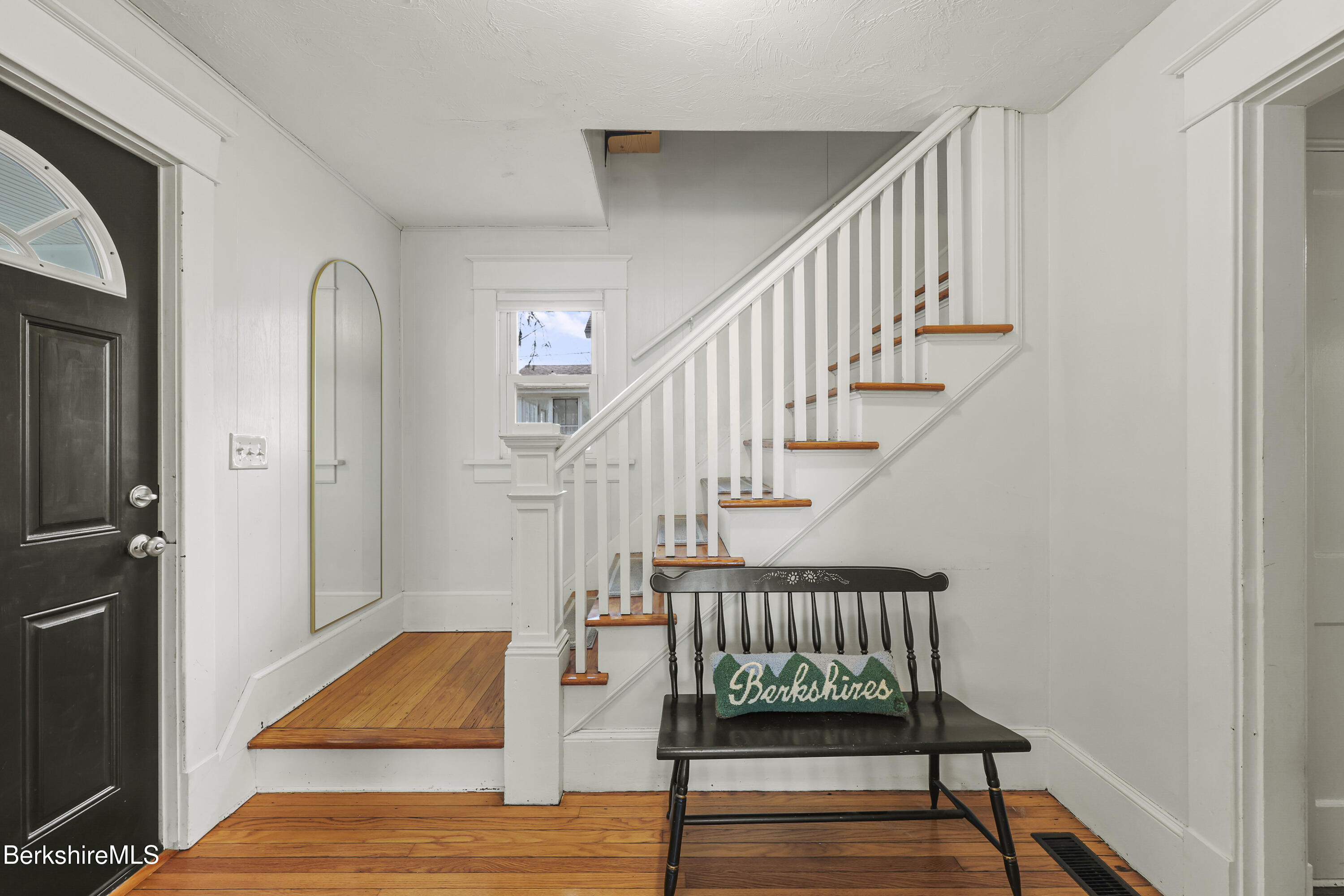 27 Morgan Street Pittsfield, MA 01201 - Photo 4 of 33 a view of staircase with wooden floor and a rug