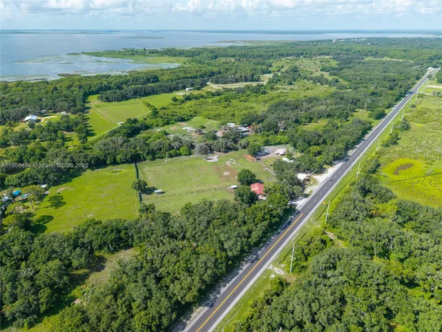 a view of a garden with a building in the background