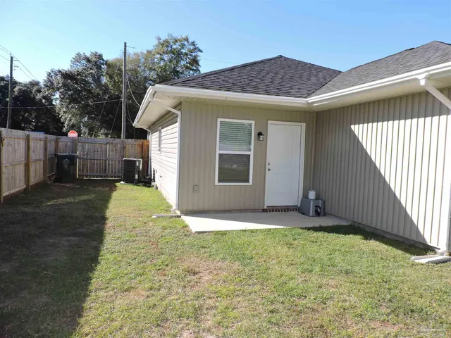 a view of a house with a yard and garage
