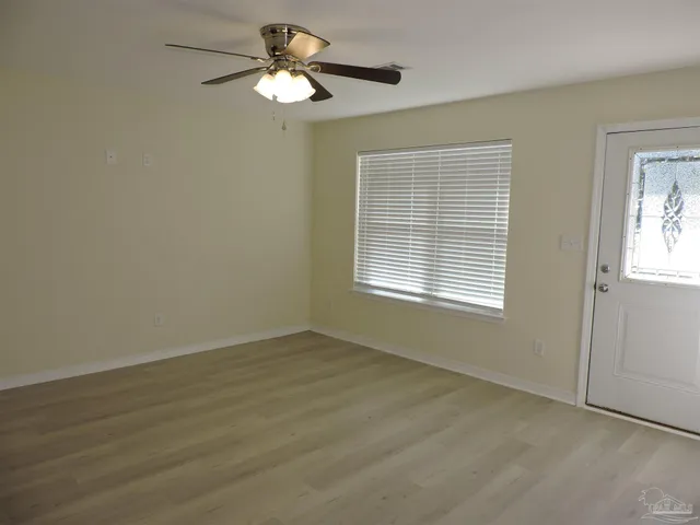 a view of an empty room with a window