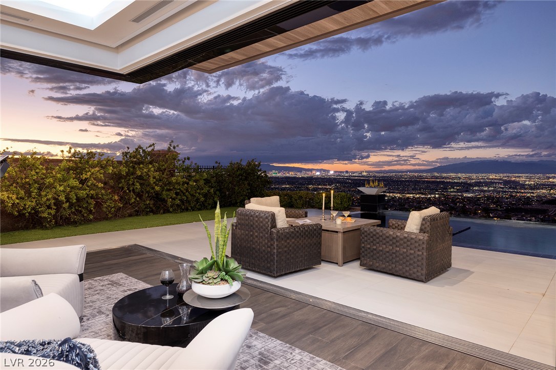 611 Cityview Ridge Drive Henderson, NV 89012 - Photo 40 of 66 Panoramic city lights and mountain views frame this seamless indoor-outdoor transition area.