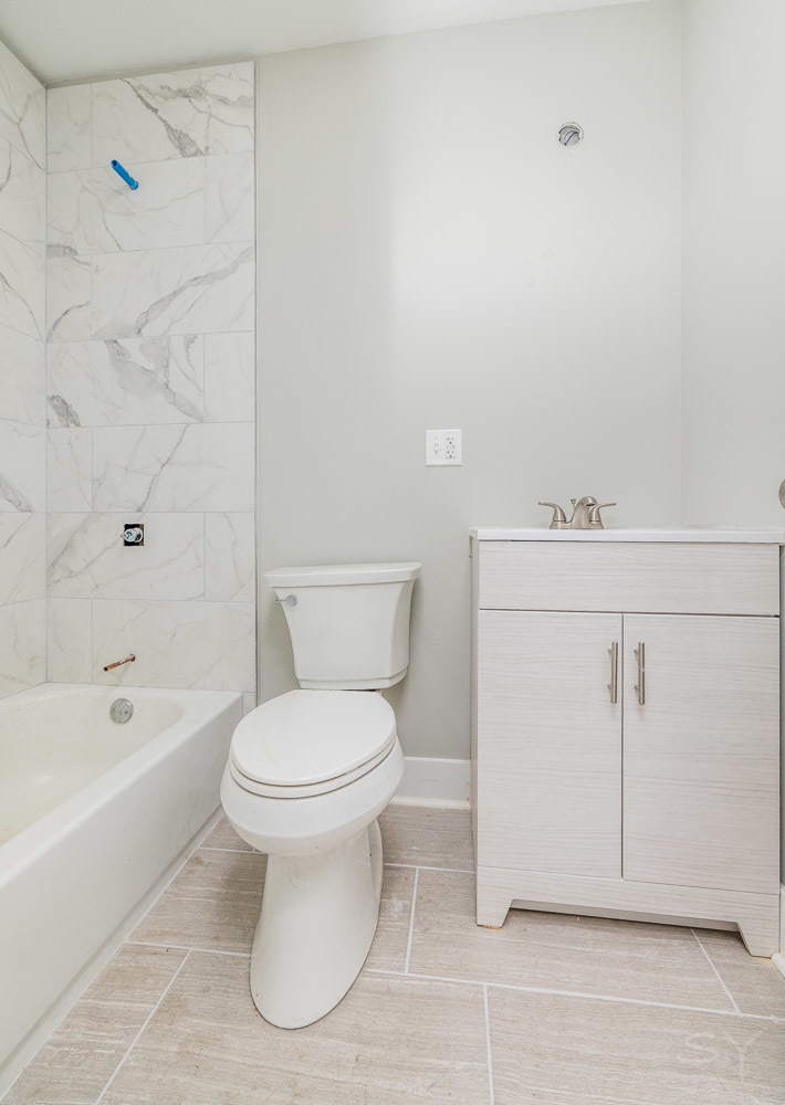 2448 South Oakley Avenue, Unit 2F Chicago, IL 60608 - Photo 11 of 14 a bathroom with a toilet and a bathtub