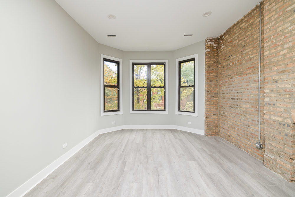 2448 South Oakley Avenue, Unit 2F Chicago, IL 60608 - Photo 5 of 14 a view of an empty room with a window