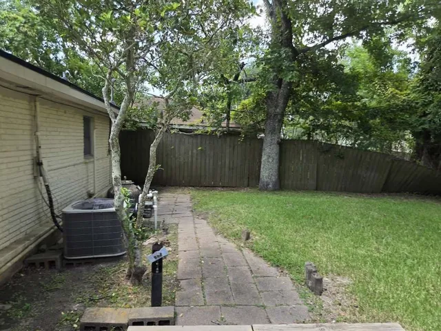 a view of a backyard with furniture