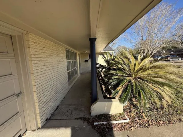 a view of a backyard of the house