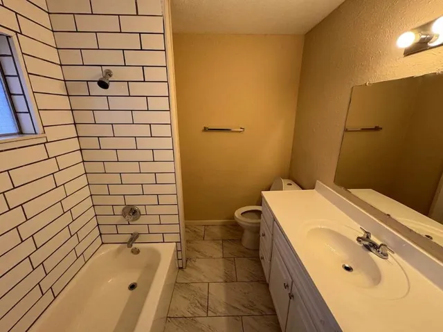 a bathroom with a bathtub and shower