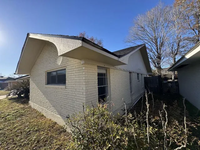 a front view of a house with yard